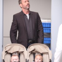 HOUSE: House (Hugh Laurie) helps out with Taub's babies in "The Confession" episode of HOUSE airing Monday, Nov. 7 (9:00-10:00 PM ET/PT) on FOX. ©2011 Fox Broadcasting Co. Cr: Adam Taylor/FOX